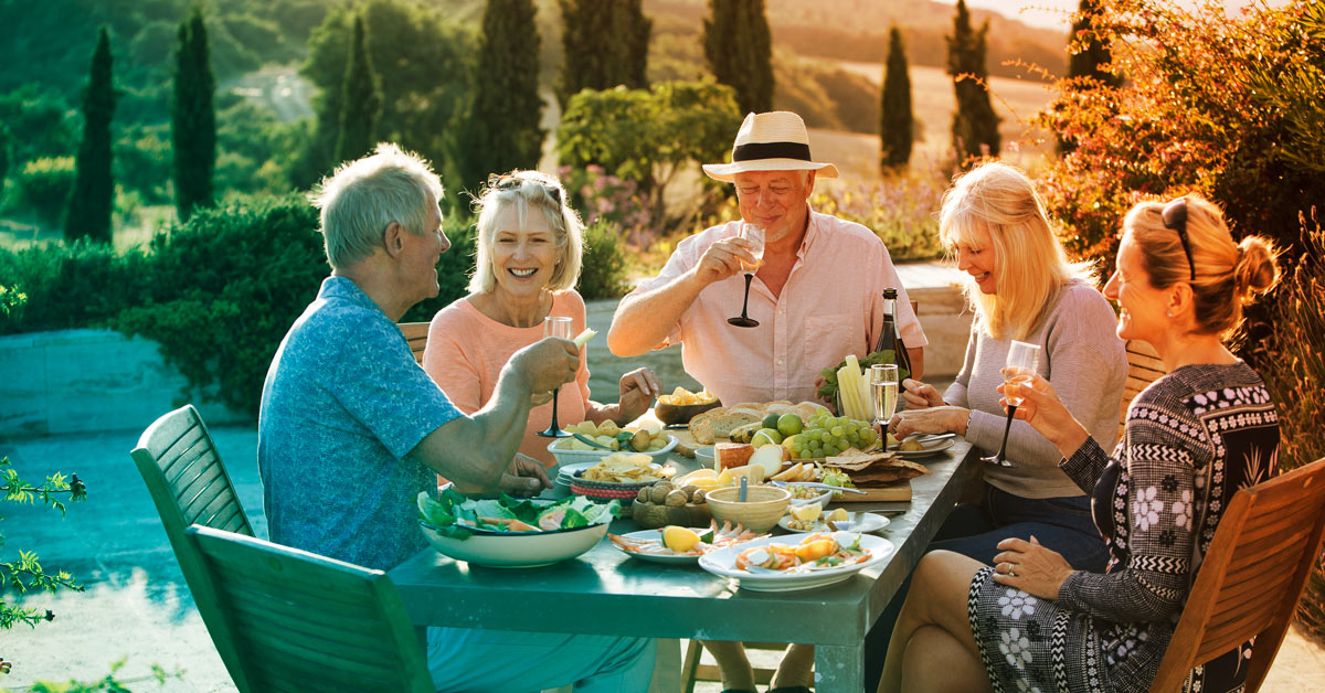 Group of elderly couples eating breakfast